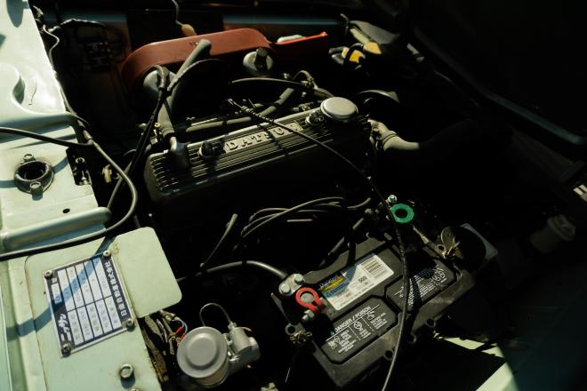 Close up of a car engine and battery